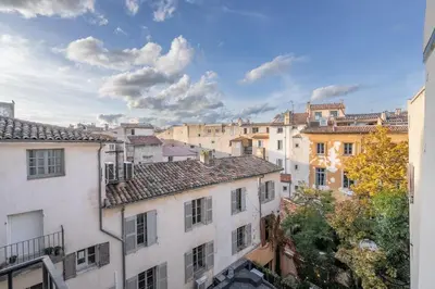 a view of a bunch of buildings in a city at 2 rooms apartment in the city center in Aix-en-Provence