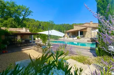 a villa with a swimming pool and a house at House for rent in Ménerbes Villa Carpe Diem in Ménerbes