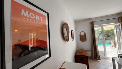 a living room with a picture on the wall at Jolie maison avec piscine , proche du centre de Bédoin in Bédoin