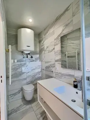 a bathroom with a toilet and a sink at Studio centre Aix - Climatisé avec terrasse in Aix-en-Provence