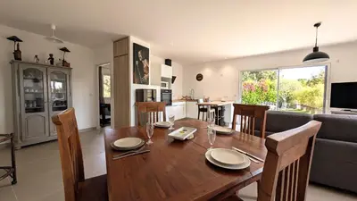 a living room with a couch and a table at Entre village et campagne in Velleron