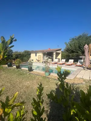 a villa with a swimming pool and a house at Suite privée tout confort in Gargas
