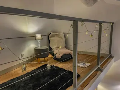a room with a bed and a table and a lamp at L'oustau étoilé in Gordes