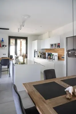 a kitchen and dining room with a wooden table at Estate in Provence in Aix-en-Provence