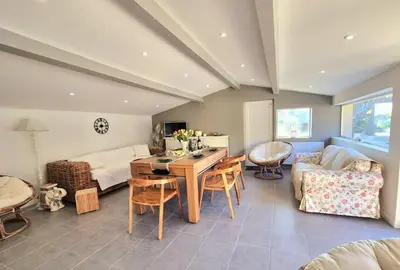 a living room with a table and a couch at Villa grand confort, piscine privée, petanque, pool house in Alleins