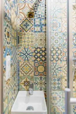 a bathroom with a sink and tiles on the wall at T4 Aix PARKING CLIM refait a neuf in Aix-en-Provence