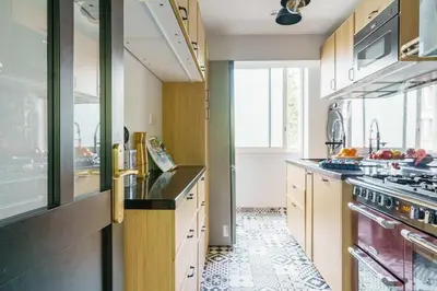 a kitchen with a sink and a stove top oven at T4 Aix PARKING CLIM refait a neuf in Aix-en-Provence
