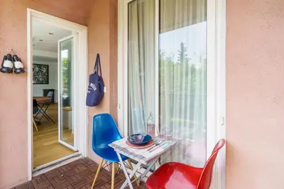 a room with a table and chairs and a window at T4 Aix PARKING CLIM refait a neuf in Aix-en-Provence