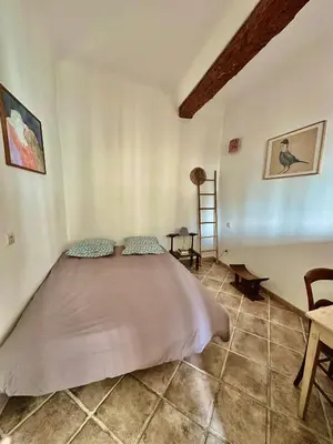 a bedroom with a large bed in a room at - Élégant cocon au cœur du centre historique - in Aix-en-Provence