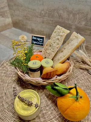 a basket of bread and other foods on a table at - Élégant cocon au cœur du centre historique - in Aix-en-Provence