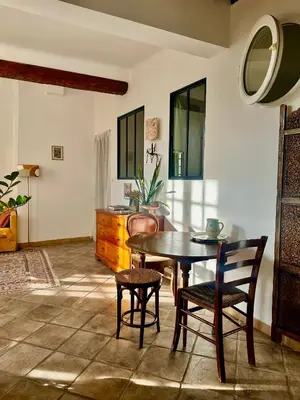 a dining room with a table and chairs at - Élégant cocon au cœur du centre historique - in Aix-en-Provence