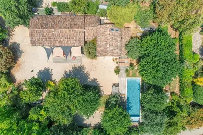 an overhead view of a house with a swimming pool at Modern Loft With Pool Near Lourmarin in Puget