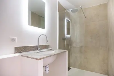 a bathroom with a sink and a shower at Grand Cèdre in Aix-en-Provence