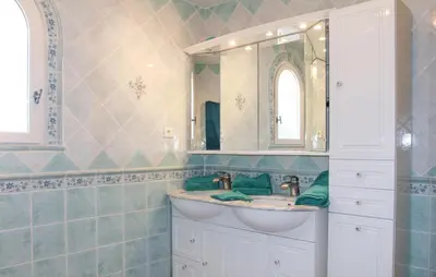 a bathroom with a sink and a mirror at Awesome Home In Saint Didier in Saint-Didier