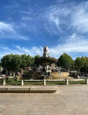 a fountain in the middle of a park at Studio coeur de ville, rue Papassaudi in Aix-en-Provence