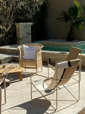 a couple of chairs and a table and a table at Maison Rosalie in Carpentras