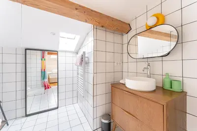 a bathroom with a sink and a mirror at Design & Cozy, 10 meters from Cours Mirabeau, AC in Aix-en-Provence
