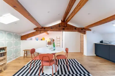 a kitchen and dining room with a table and chairs at Design & Cozy, 10 meters from Cours Mirabeau, AC in Aix-en-Provence