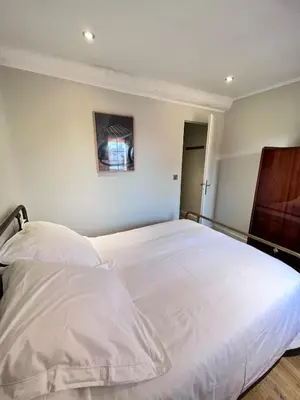 a bedroom with a large white bed in it at La Terrasse, 2 chambres, hyper centre in Aix-en-Provence