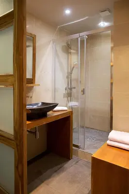 a bathroom with a sink and a shower at AJOUCADOU premiere loge in Lourmarin
