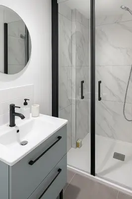 a bathroom with a sink and a shower at Cozy et elegant studio Aix en Provence centre in Aix-en-Provence