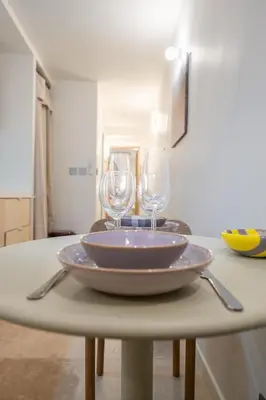two wine glasses are sitting on a table at Logement elegant avec patio prive et climatisation in Aix-en-Provence
