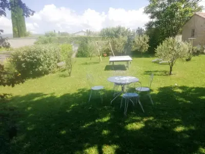 a picnic table and chairs in a yard at Les Granges in Villars