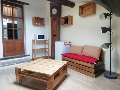 a living room with a couch and a table at Les Granges in Villars