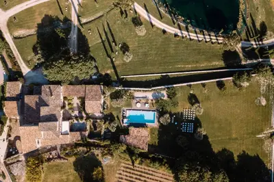 an overhead view of a house with a swimming pool at Domaine de la barbeirasse in Céreste