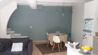 a living room with a couch and a table at Charming village house in Éguilles