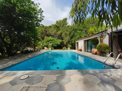 a swimming pool in the backyard of a house at mas alpilles in Eyguières