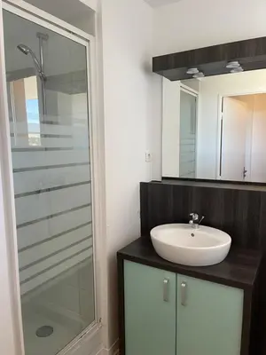 a bathroom with a sink and a glass shower at Charmant appartement hotel calme à Aix en Provence in Aix-en-Provence