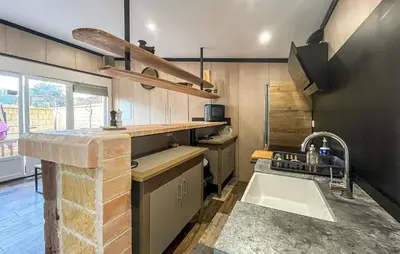 a kitchen with a sink and a counter top at Awesome Home In Miramas With Swimming Pool in Miramas