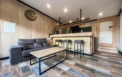 a living room with a couch and a table at Awesome Home In Miramas With Swimming Pool in Miramas