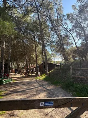 a park with a fence and trees in the background at Appartement domaine de Pont Royal in Mallemort