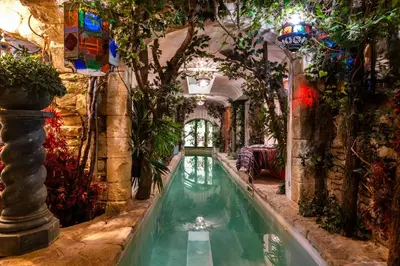 a swimming pool in a house with an indoor garden at Signature Home Pool & Panoramic Terrace in Goult