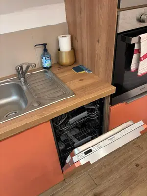 a kitchen with a sink and a dishwasher at Appartement Turandot, 1 chambre, près du Cours Mirabeau in Aix-en-Provence