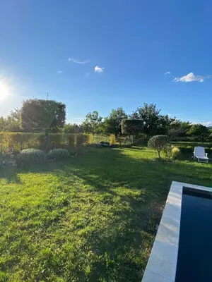 a view of a yard with a field of grass at La Roussillonnaise in Roussillon
