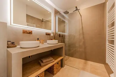 a bathroom with a sink and a shower at Magnifique villa au coeur de la campagne de Gordes in Gordes