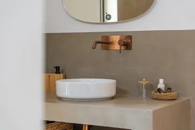 a white sink on a counter in a bathroom at Magnifique villa au coeur de la campagne de Gordes in Gordes