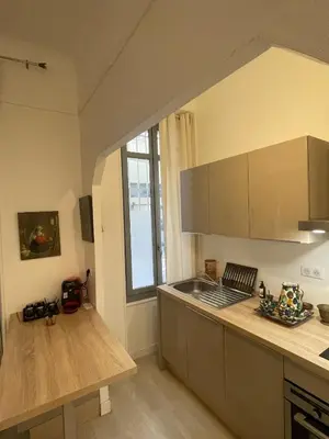 a kitchen with a sink and a counter top at T2 calme centre Aix Clim Fibre in Aix-en-Provence