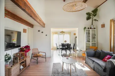 a living room with a couch and a table at La Maison Duplex 3 Chambres - Gîte La Bergerie du Ventoux in Mormoiron