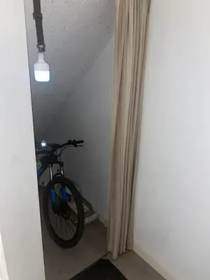 a bike parked in a room next to a curtain at The Provençal orchid in Malemort-du-Comtat