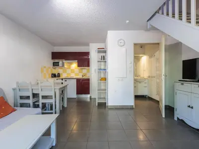 a kitchen and dining room with a table and chairs at D du Ventoux D N55 3P6 in Aubignan
