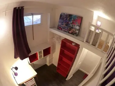 a small room with a red cabinet and a window at Joli appartement atypique dans le centre d'Aix in Aix-en-Provence