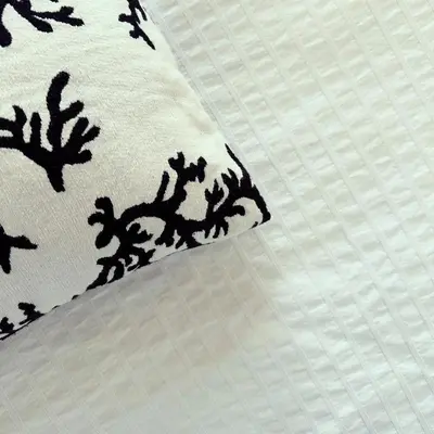 a close up of a pillow on a bed at Superbe mas provençal avec piscine dans le Luberon in Lagnes