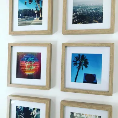 a group of framed pictures hanging on a wall at Superbe mas provençal avec piscine dans le Luberon in Lagnes