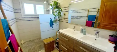 a bathroom with a sink and a mirror at Le Colibri Très belle maison près d'Avignon in Carpentras
