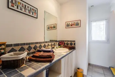a bathroom with a sink and a mirror at Les gites de Bel-Air en Luberon in Les Taillades
