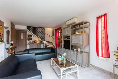 a living room with a couch and a table at Les gites de Bel-Air en Luberon in Les Taillades